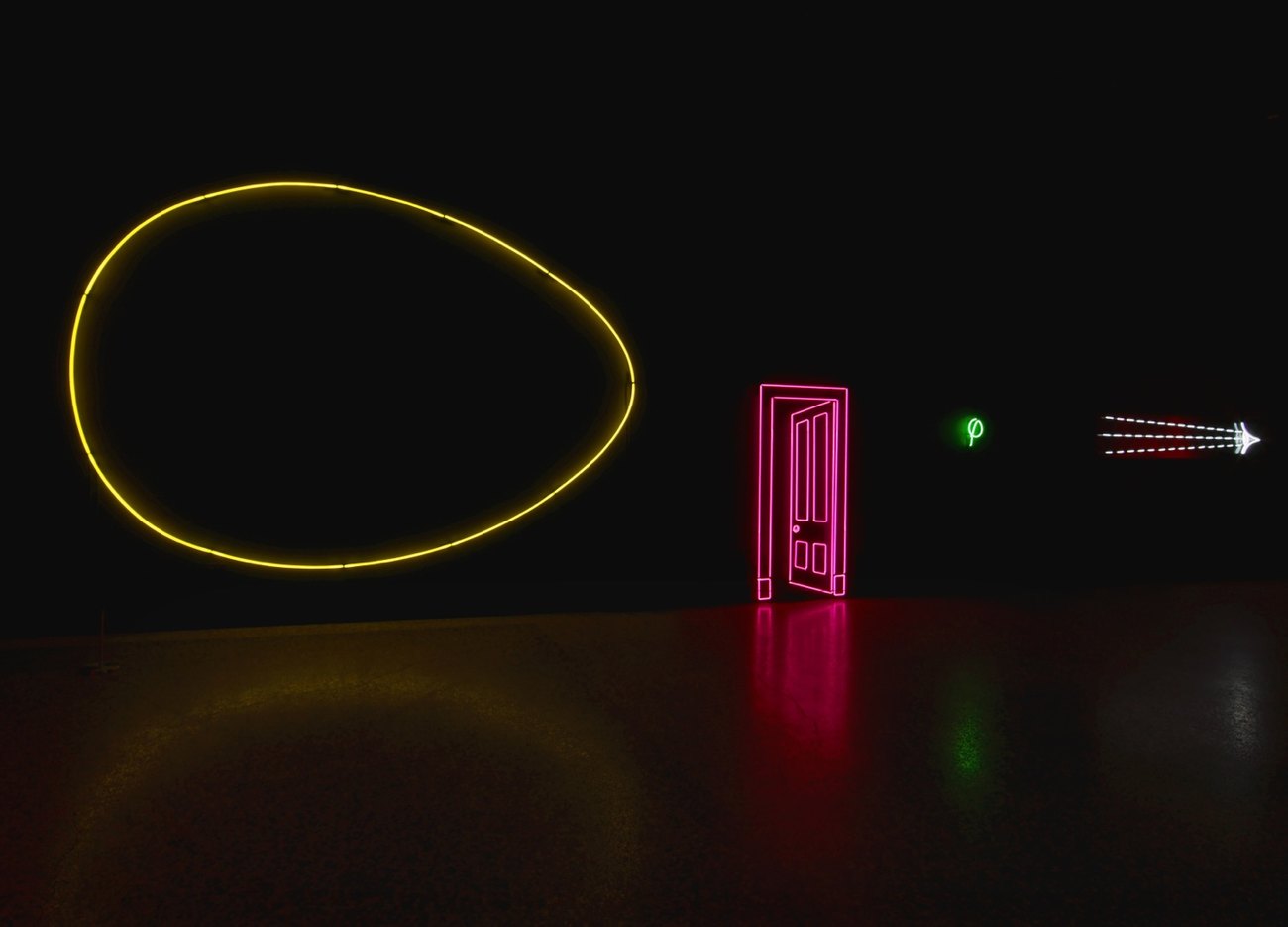 Yellow neon egg, red neon door, against a black backdrop