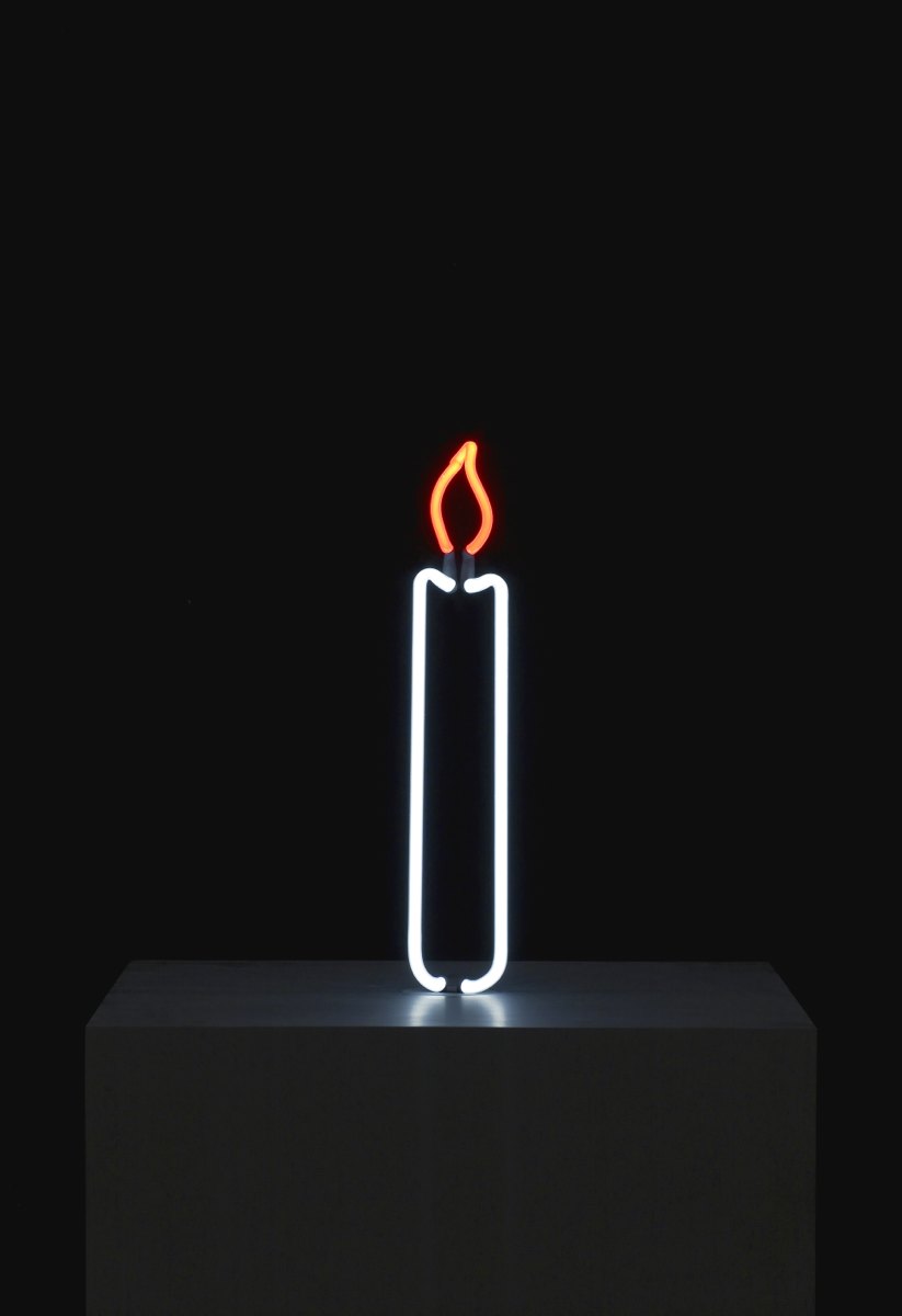 A neon image of a candle against a black background