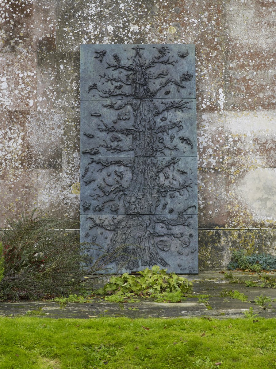 A large rectangular black object with a tree depicted