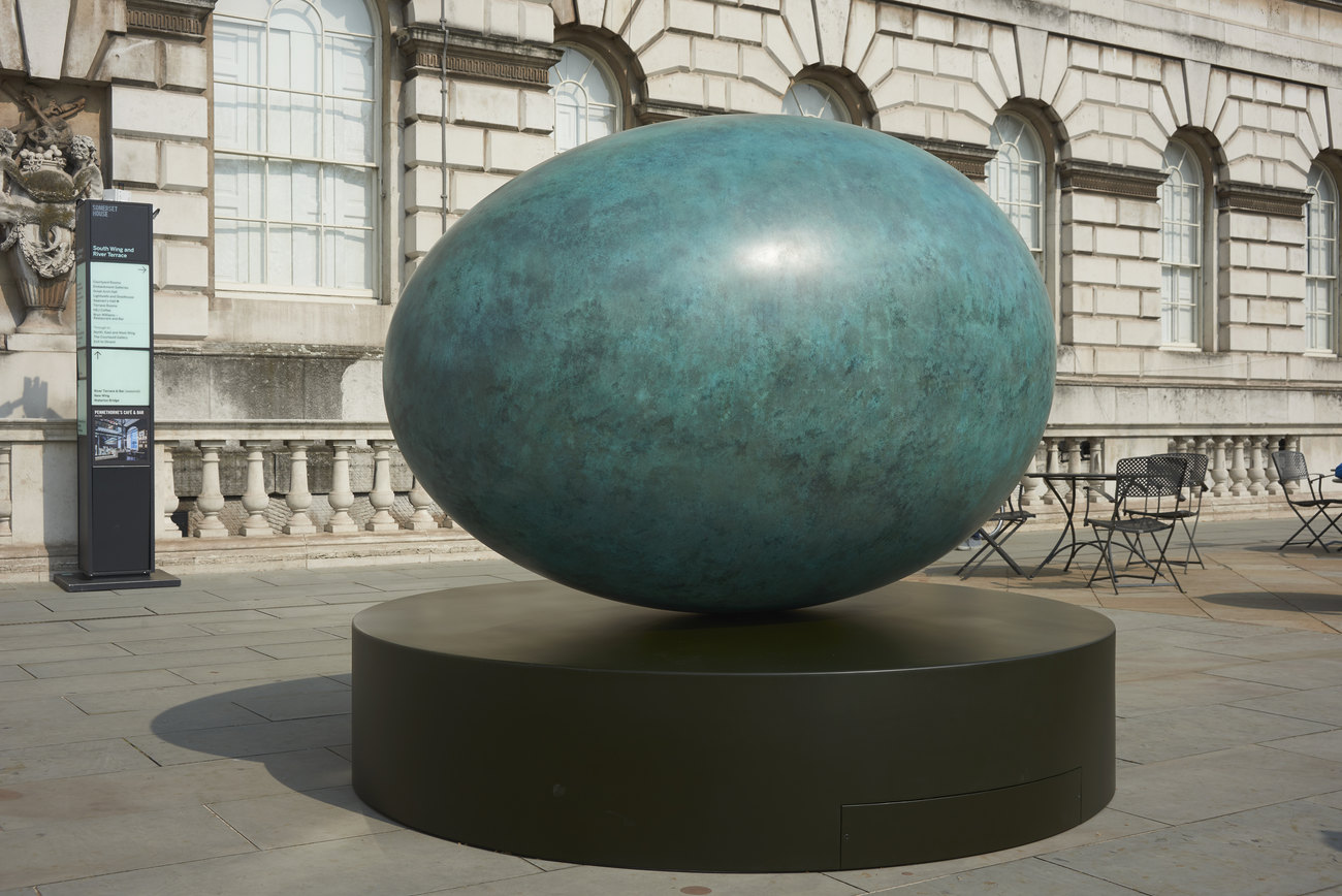 An image of a bronze patinated egg, exhibited outside Somerset House