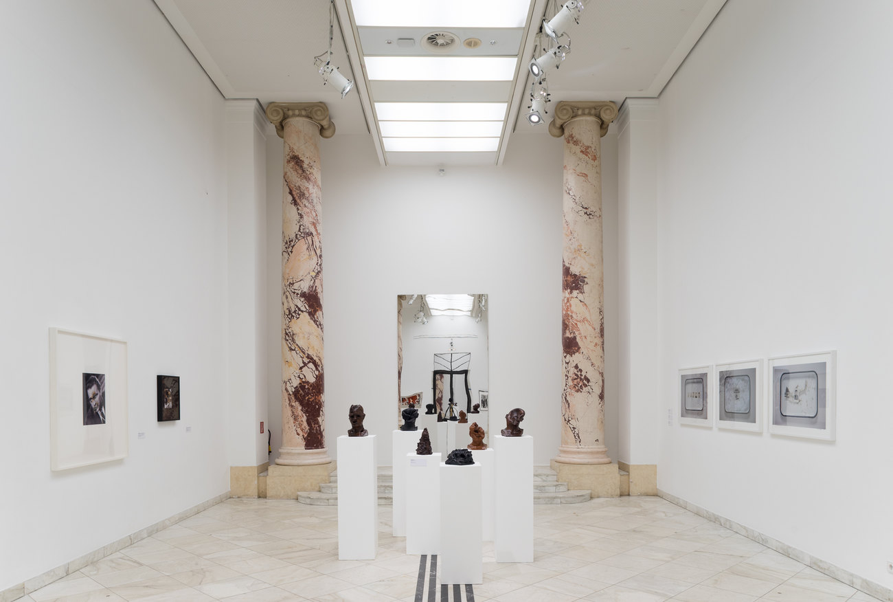 Image of a white gallery space exhibiting Gavin Turk's En Face Series 