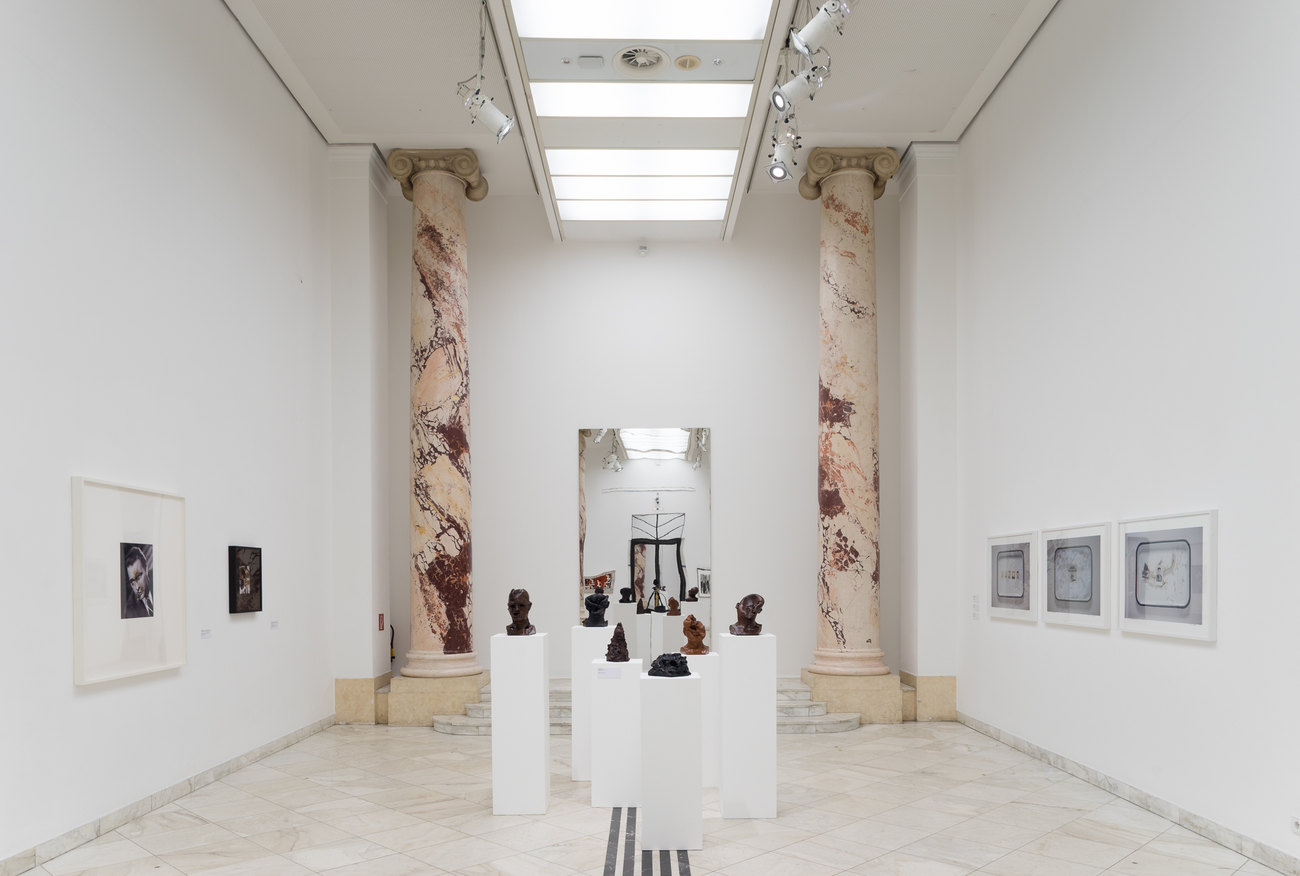 Image of a white gallery space exhibiting Gavin Turk's En Face Series