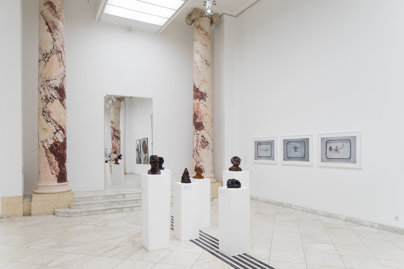 Image of a white gallery space exhibiting Gavin Turk's En Face Series