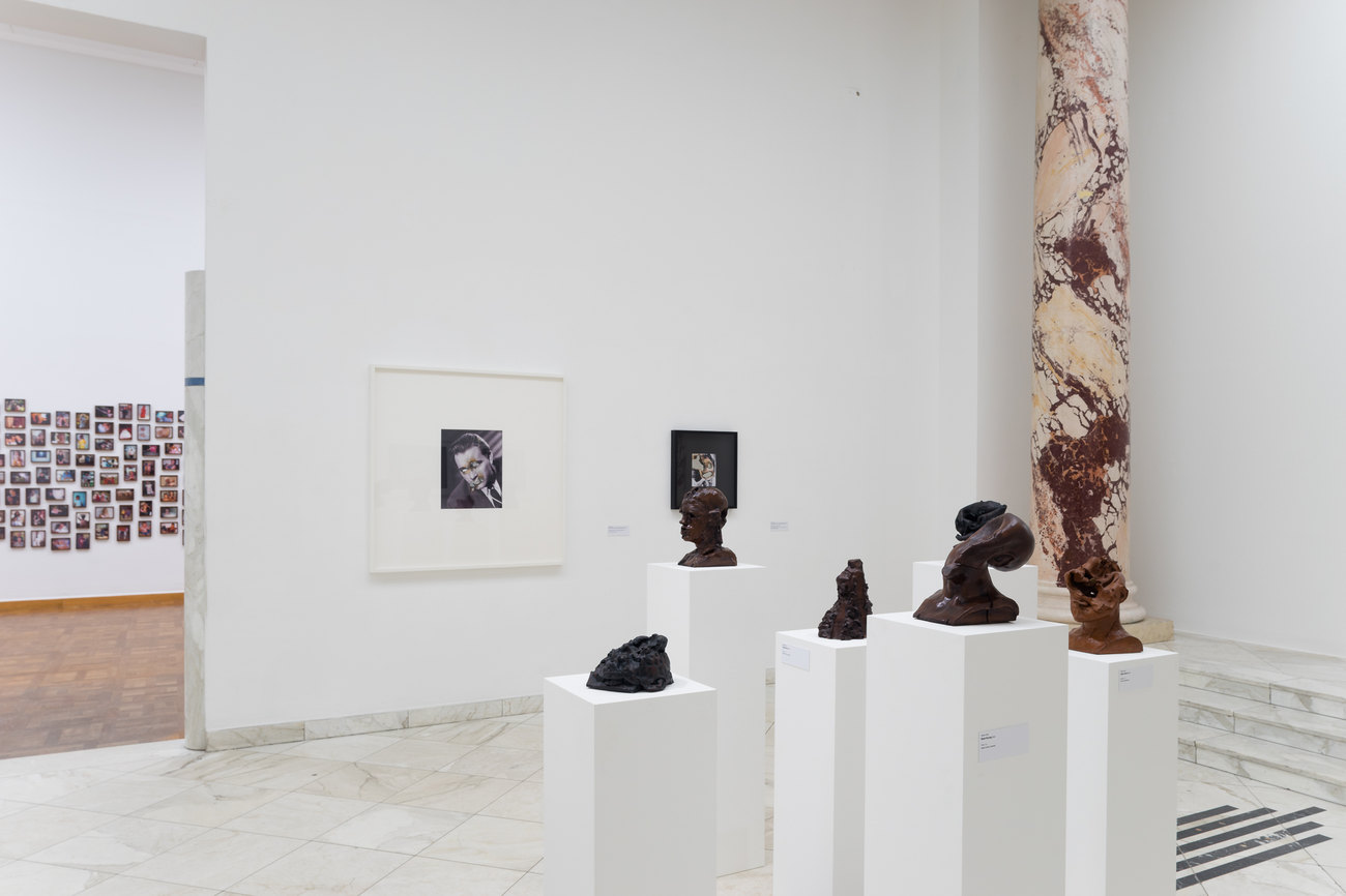 Image of a white gallery space exhibiting Gavin Turk's En Face Series