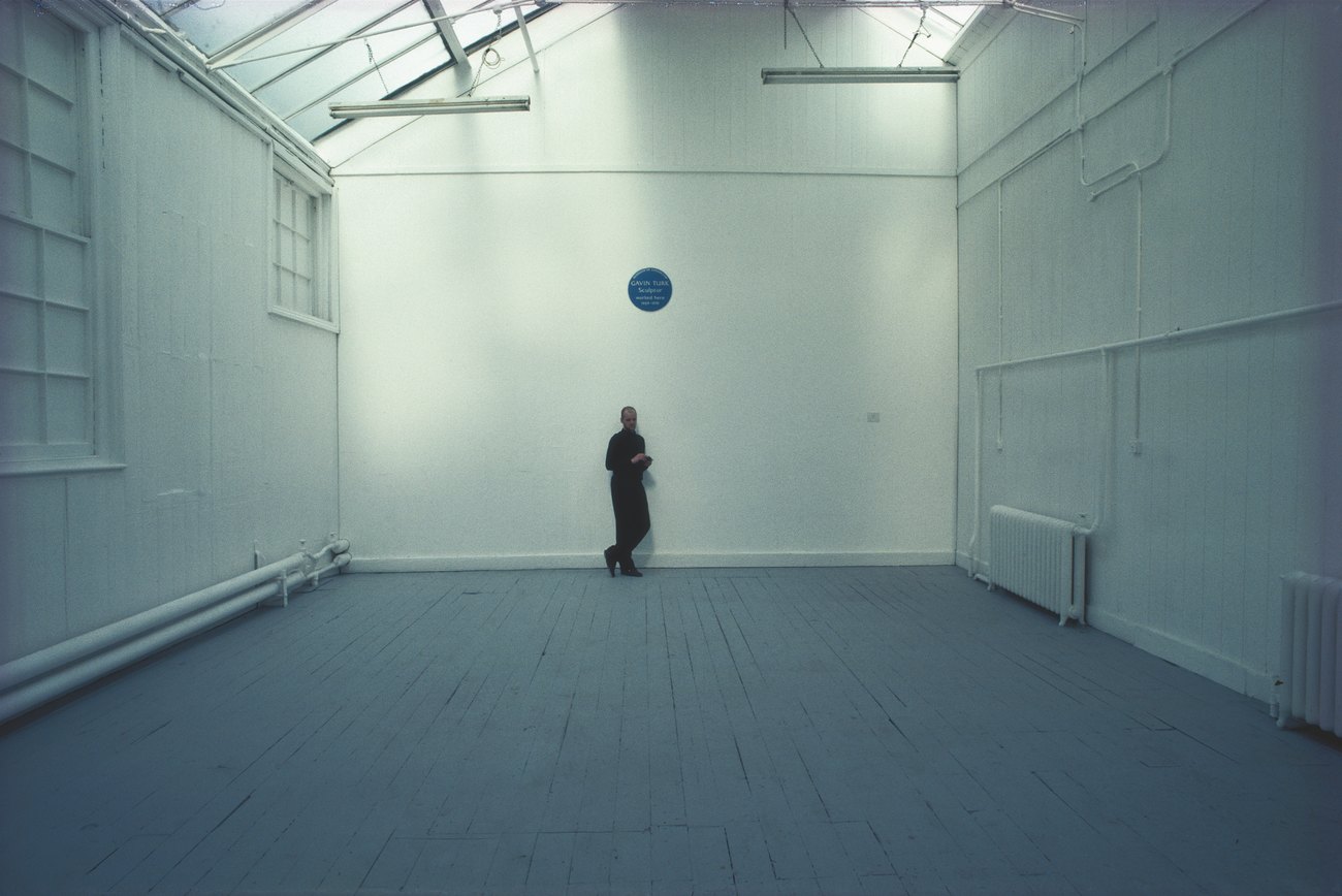 A photo of Gavin Turk with his installation 'Cave' in 1991