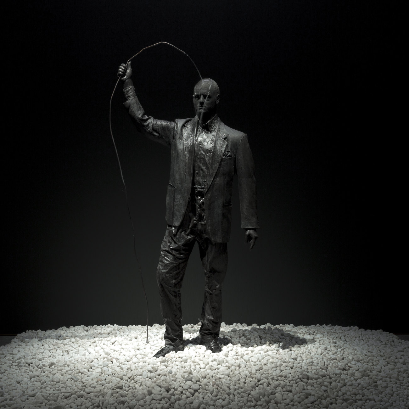 A self portrait of Gavin Turk as a Bronze statue 