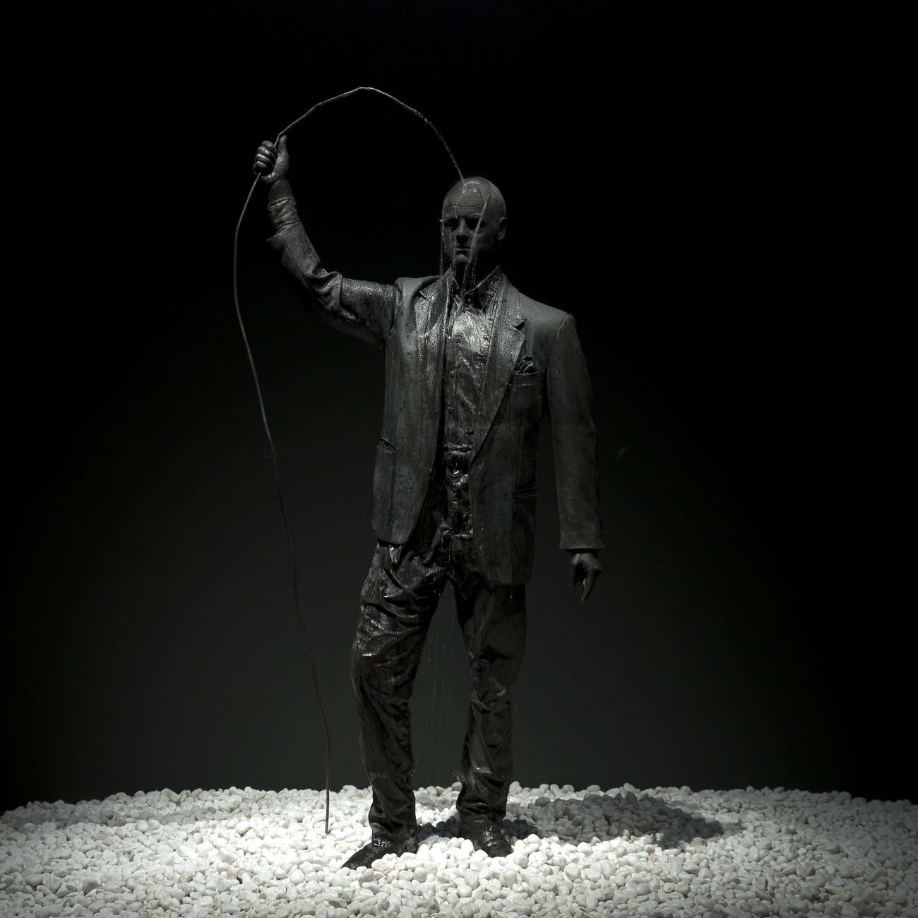 A self portrait of Gavin Turk as a Bronze statue