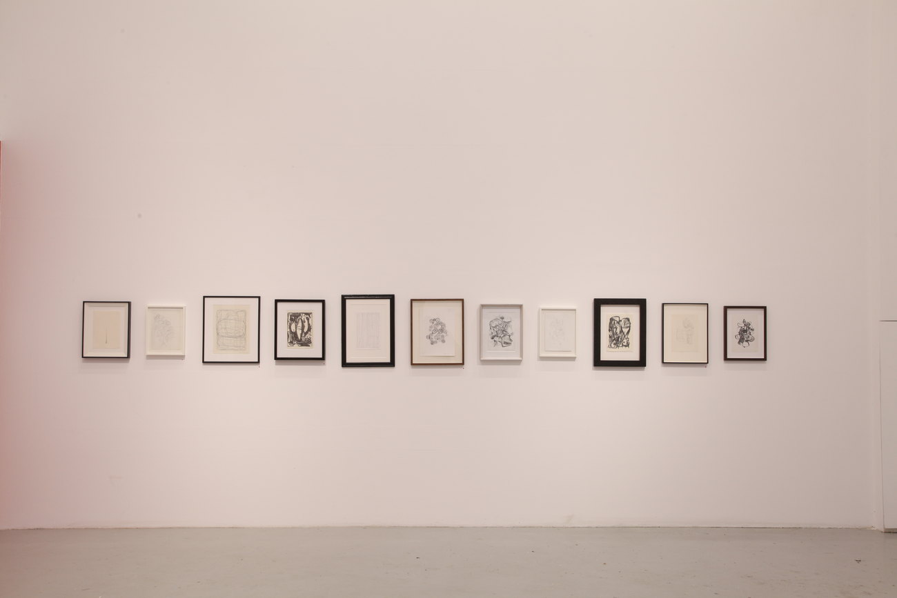 A series of drawings made by Gavin Turk framed and hung on a white wall 
