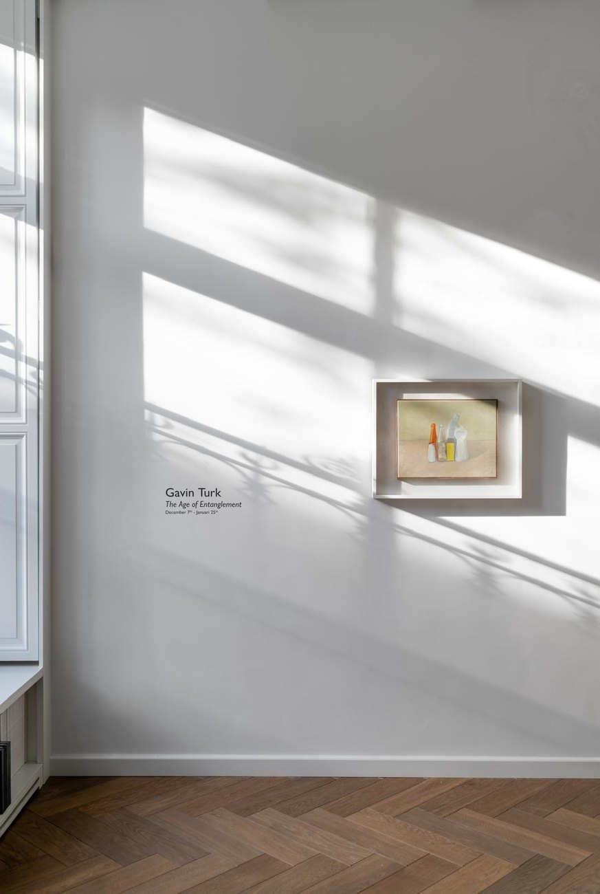 Photo shows painting on white wall