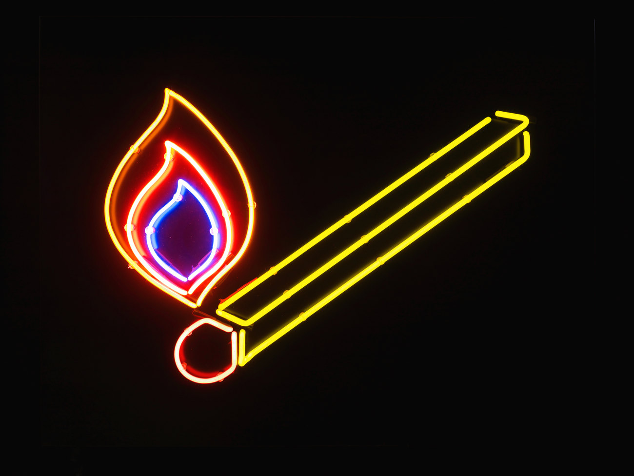 photo shows a neon light depicting a match 