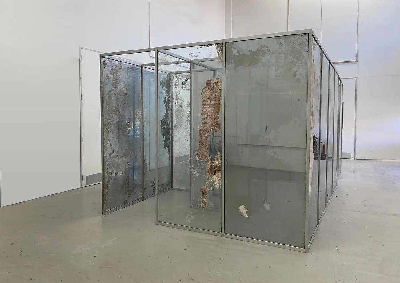 Image shows a large mirror maze, deteriorated 