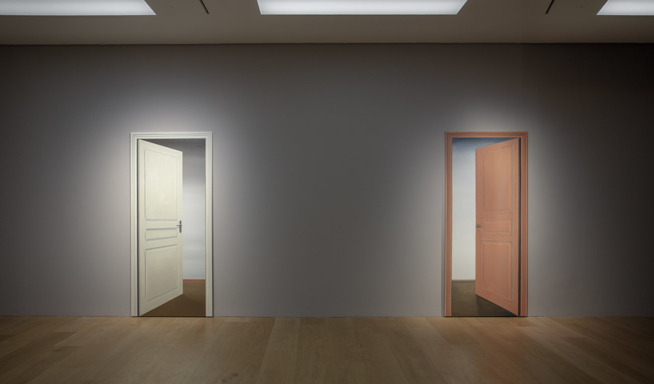 Photos of an exhibition by Gavin Turk of paintings of doorways 