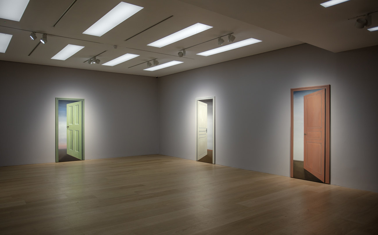 Photo of an exhibition by Gavin Turk of paintings of doorways 