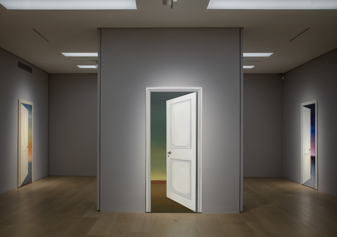 Photo of an exhibition by Gavin Turk of paintings of doorways 