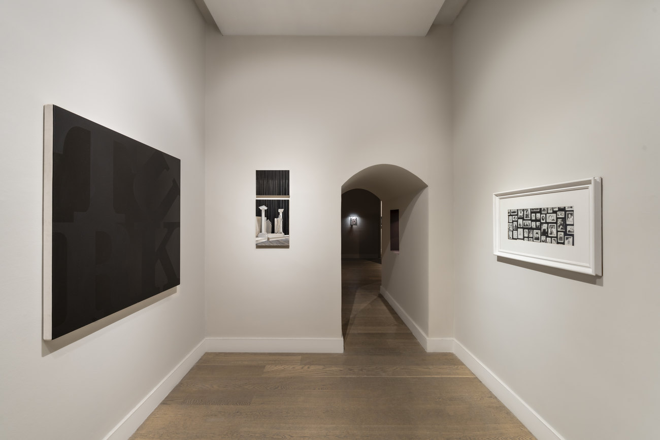 Photo of installation of Gavin Turk artwork black canvas with words TURK